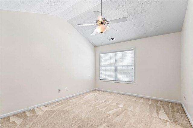 2555 Flat Shoals Rd Unit 2006, Atlanta, GA 30349 - spare room featuring vaulted ceiling, ceiling fan, light carpet, and a textured ceiling