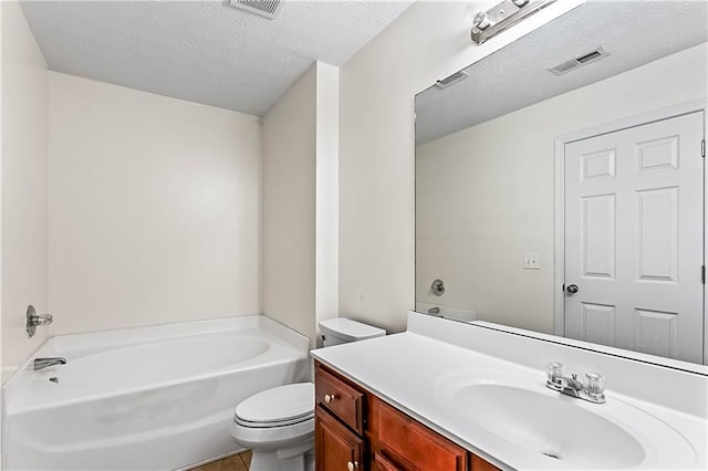 2555 Flat Shoals Rd Unit 2006, Atlanta, GA 30349 - bathroom with vanity, a bathtub, a textured ceiling, and tile patterned floors