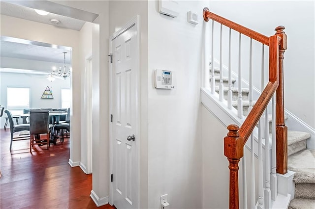 2555 Flat Shoals Rd Unit 2006, Atlanta, GA 30349 - staircase with wood finished floors and a chandelier