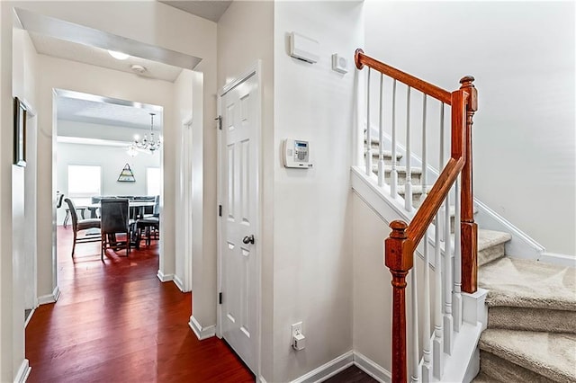 2555 Flat Shoals Rd Unit 2006, Atlanta, GA 30349 - staircase featuring a chandelier and wood finished floors