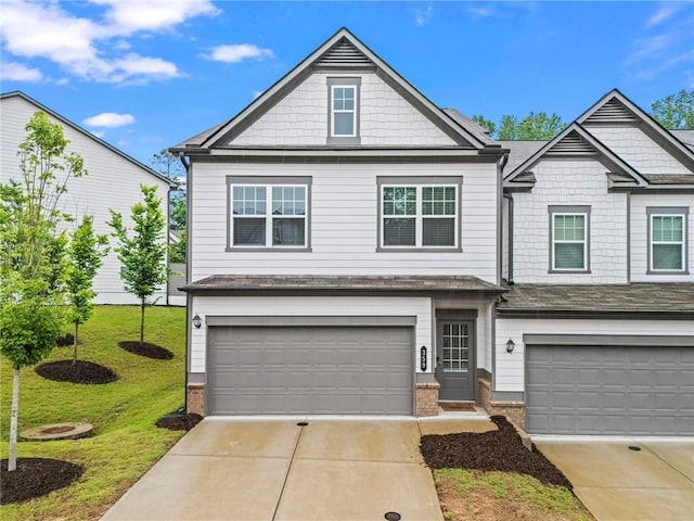 359 Crider Ct, Woodstock, GA 30188 - craftsman inspired home with an attached garage, driveway, a front lawn, and brick siding