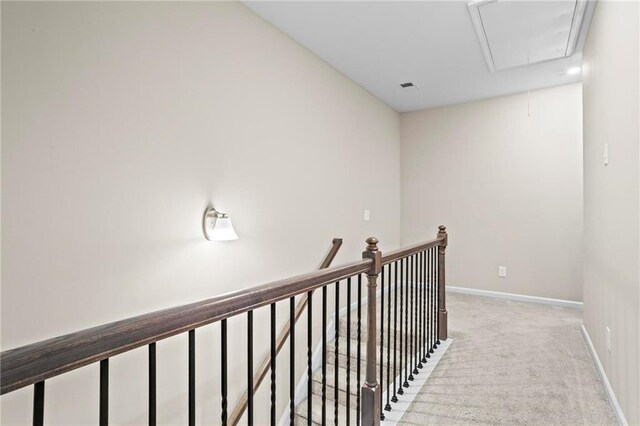 359 Crider Ct, Woodstock, GA 30188 - hallway with attic access, light colored carpet, baseboards, and an upstairs landing