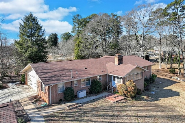 back of house with a sunroom