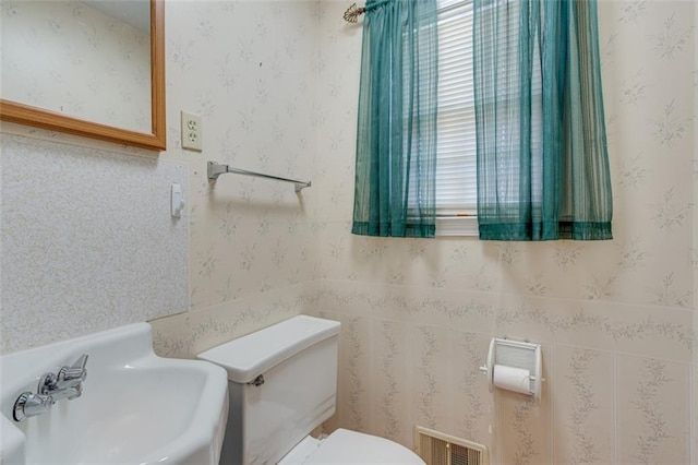 bathroom featuring sink and toilet