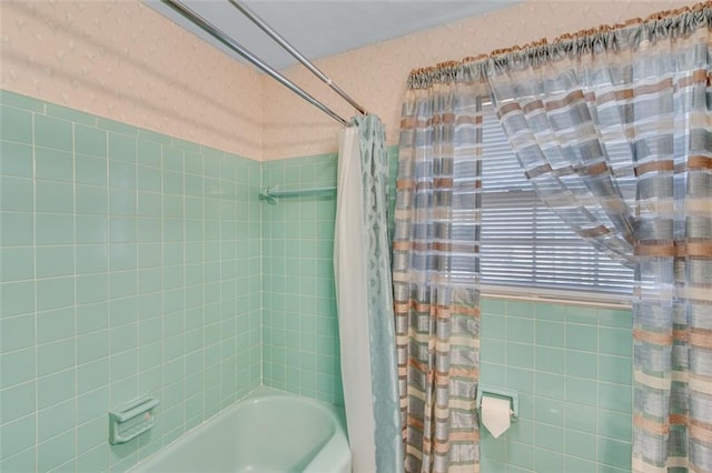 bathroom with shower / bathtub combination with curtain