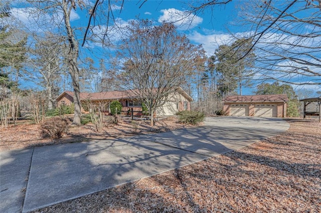 view of front of home with an outbuilding and a garage