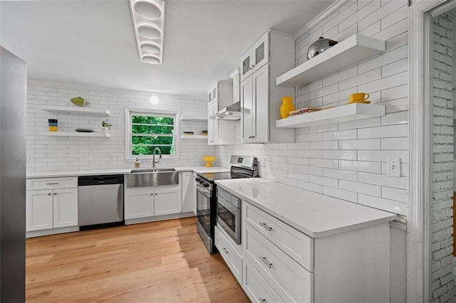 3332 Saint John Dr, East Point, GA 30344 - kitchen with open shelves, appliances with stainless steel finishes, a sink, decorative backsplash, and light countertops