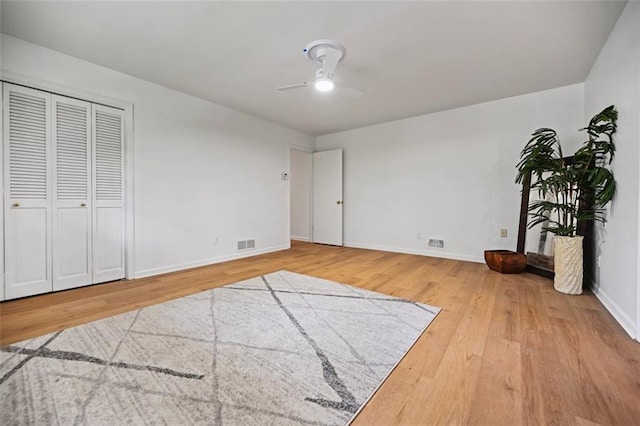 3332 Saint John Dr, East Point, GA 30344 - unfurnished bedroom featuring wood finished floors, baseboards, and a ceiling fan