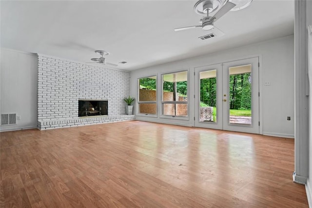 3332 Saint John Dr, East Point, GA 30344 - unfurnished living room featuring a ceiling fan, wood finished floors, and a brick fireplace