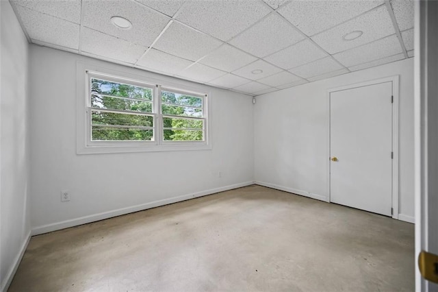 3332 Saint John Dr, East Point, GA 30344 - spare room with concrete flooring, a paneled ceiling, and baseboards