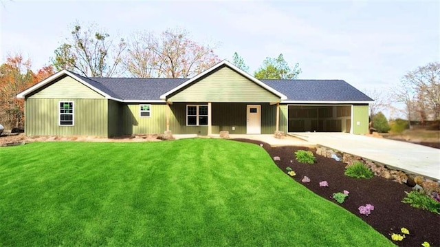 ranch-style house with a garage and a front yard