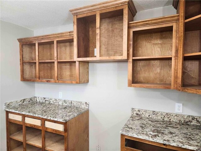 kitchen with hanging light fixtures, concrete flooring, lofted ceiling, and ceiling fan