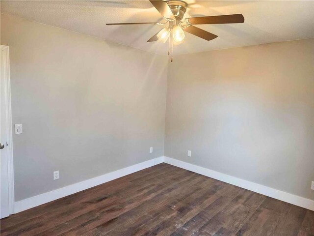 unfurnished bedroom featuring dark hardwood / wood-style flooring and ceiling fan