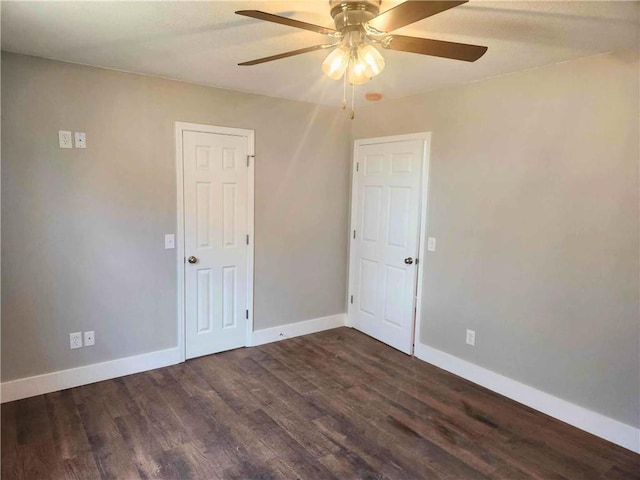 unfurnished room featuring ceiling fan and dark hardwood / wood-style flooring