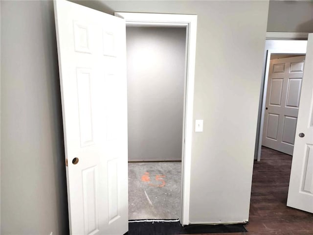 unfurnished bedroom featuring dark wood-type flooring