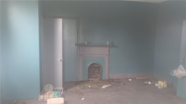 unfurnished living room featuring a fireplace