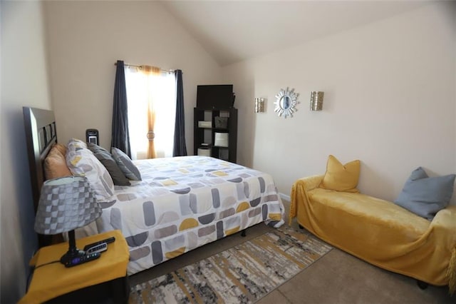 carpeted bedroom featuring vaulted ceiling