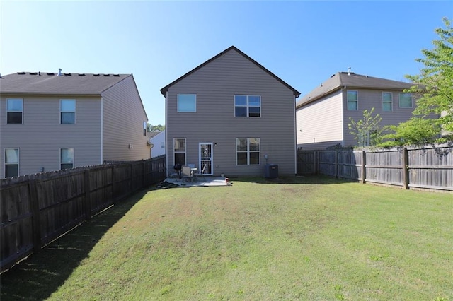 back of house with a fenced backyard, central AC unit, and a lawn