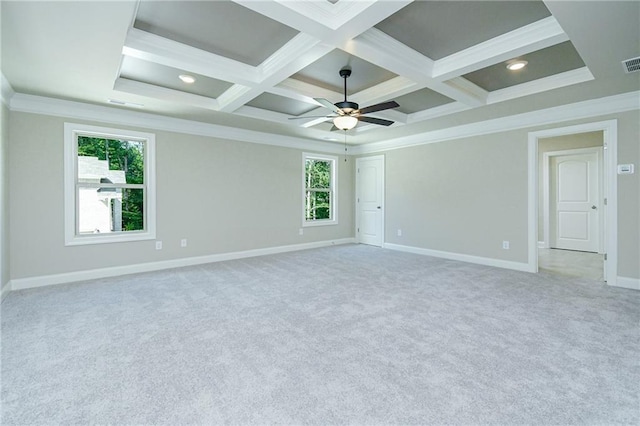 spare room featuring crown molding, coffered ceiling, and light colored carpet