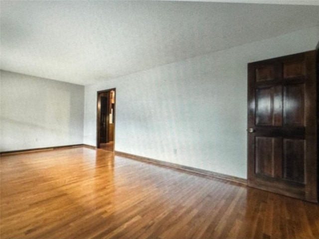 unfurnished room featuring hardwood / wood-style floors