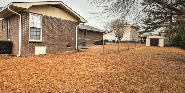 view of side of property featuring a shed