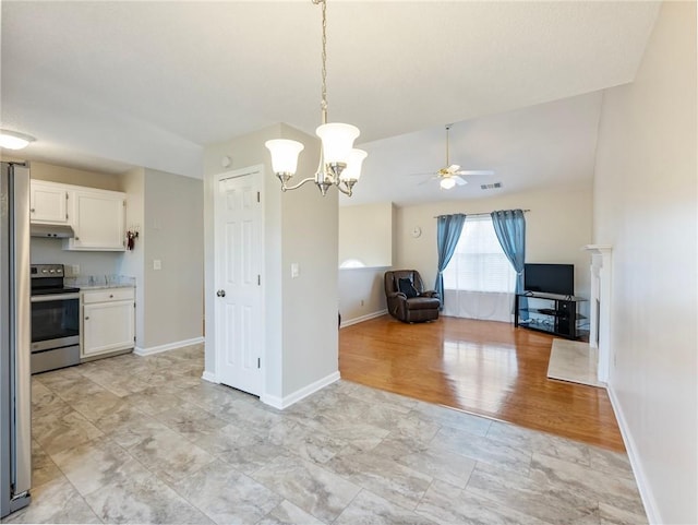 kitchen featuring visible vents, under cabinet range hood, light countertops, stainless steel range with electric cooktop, and white cabinetry