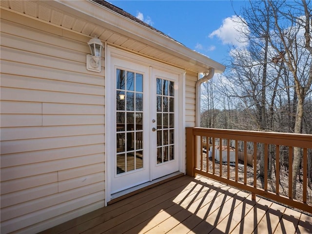 wooden deck featuring french doors