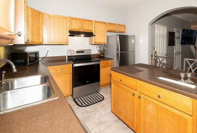 kitchen featuring appliances with stainless steel finishes and sink