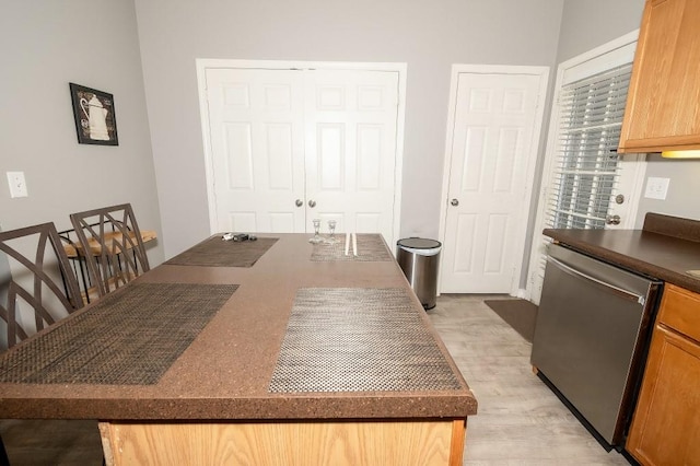 dining space with light hardwood / wood-style floors