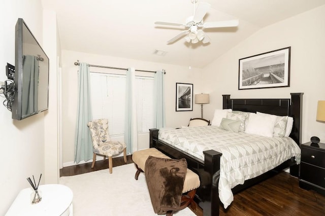 bedroom featuring ceiling fan, vaulted ceiling, and dark hardwood / wood-style flooring