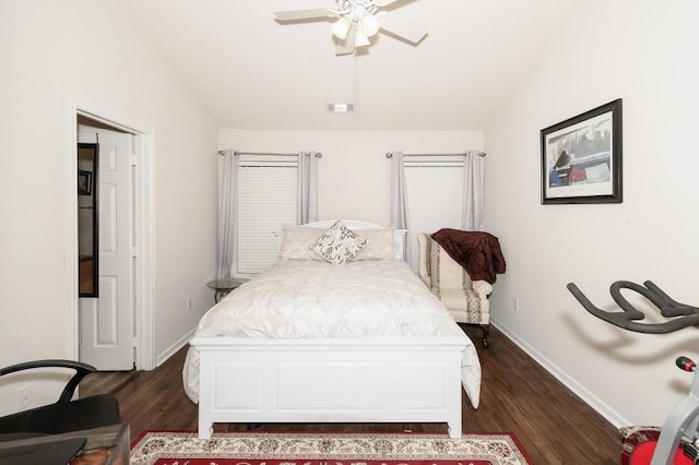 bedroom featuring ceiling fan and dark wood-type flooring