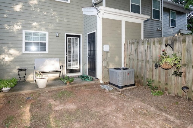 entrance to property featuring central air condition unit