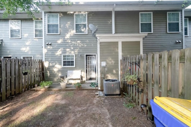 back of property featuring central AC unit and a patio area