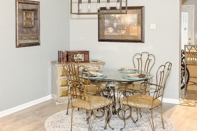 dining room with hardwood / wood-style floors