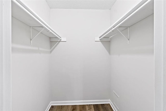 2199 Summertown Dr, Norcross, GA 30071 - walk in closet with dark wood-style flooring