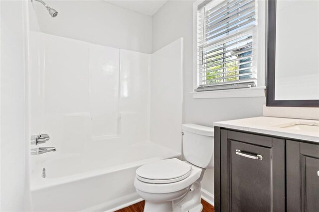 2199 Summertown Dr, Norcross, GA 30071 - full bathroom featuring vanity, wood finished floors, toilet, and tub / shower combination