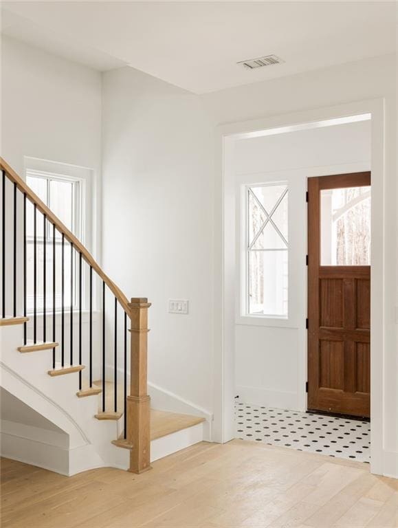 foyer entrance featuring hardwood / wood-style floors