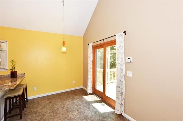 doorway featuring vaulted ceiling