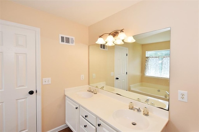 bathroom featuring vanity and a tub to relax in