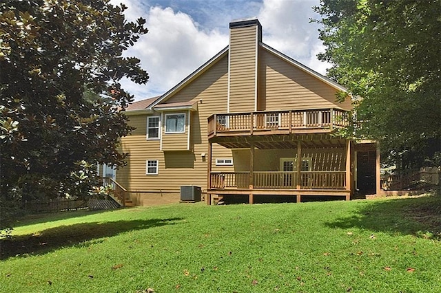 back of house with a wooden deck, a yard, and central AC unit