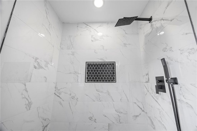 details with a tile shower