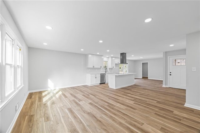 unfurnished living room featuring light hardwood / wood-style flooring