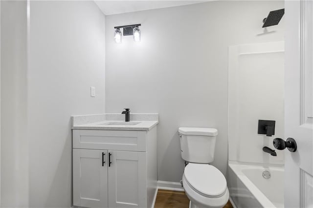 full bathroom with vanity, bathing tub / shower combination, and toilet