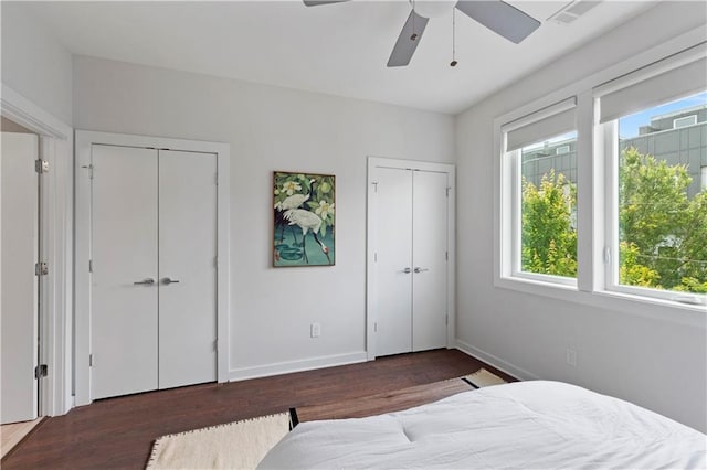 415 Gartrell St SE Unit 15, Atlanta, GA 30312 - bedroom featuring multiple closets, multiple windows, wood finished floors, and a ceiling fan