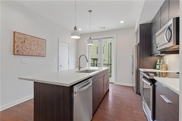 415 Gartrell St SE Unit 15, Atlanta, GA 30312 - kitchen with appliances with stainless steel finishes, light countertops, modern cabinets, a kitchen island with sink, and recessed lighting