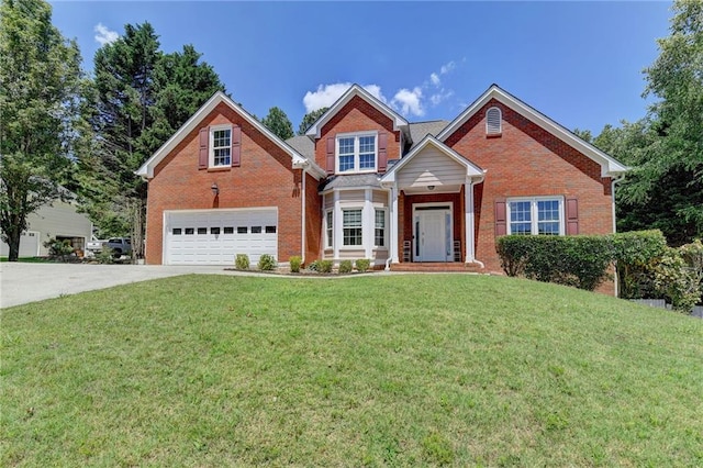 view of front of home featuring a front yard and a garage