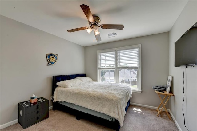 carpeted bedroom with ceiling fan