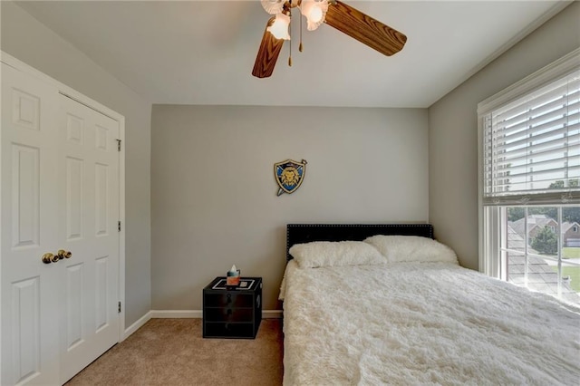 carpeted bedroom with ceiling fan