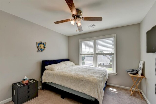 carpeted bedroom featuring ceiling fan