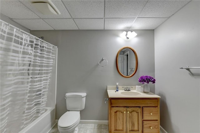 full bathroom featuring tile patterned flooring, shower / bathtub combination with curtain, toilet, a paneled ceiling, and vanity